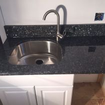 Black Quartz Around Stainless Steel Sink